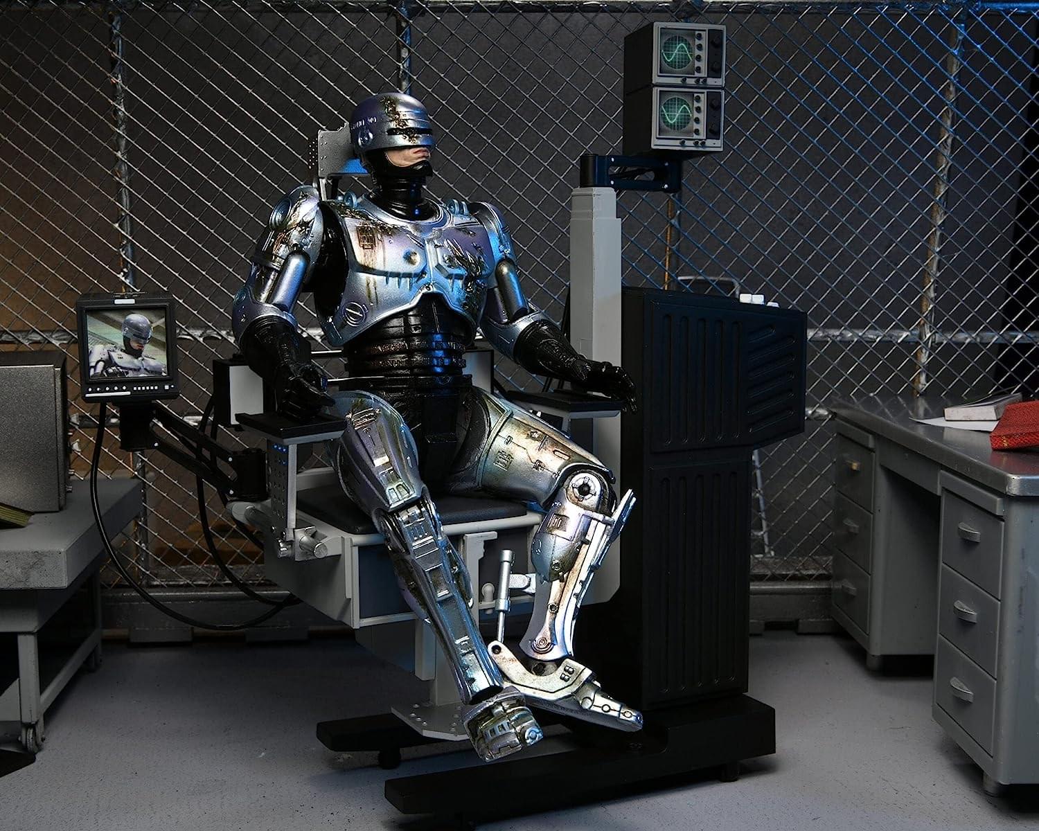 RoboCop Ultimate 7 Inch Action Figure | Battle Damaged RoboCop with Chair