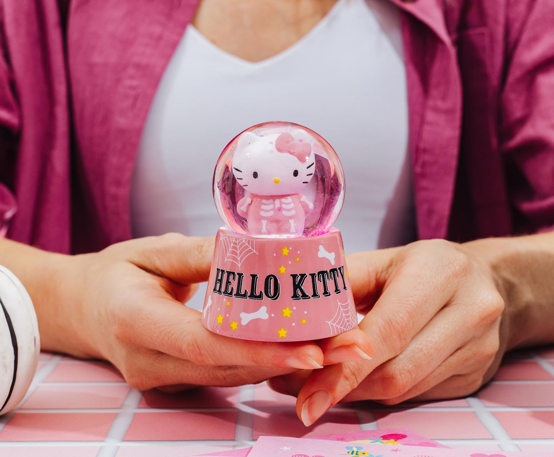 Sanrio Hello Kitty Pink Skeleton 3-Inch Mini Light-Up Snow Globe
