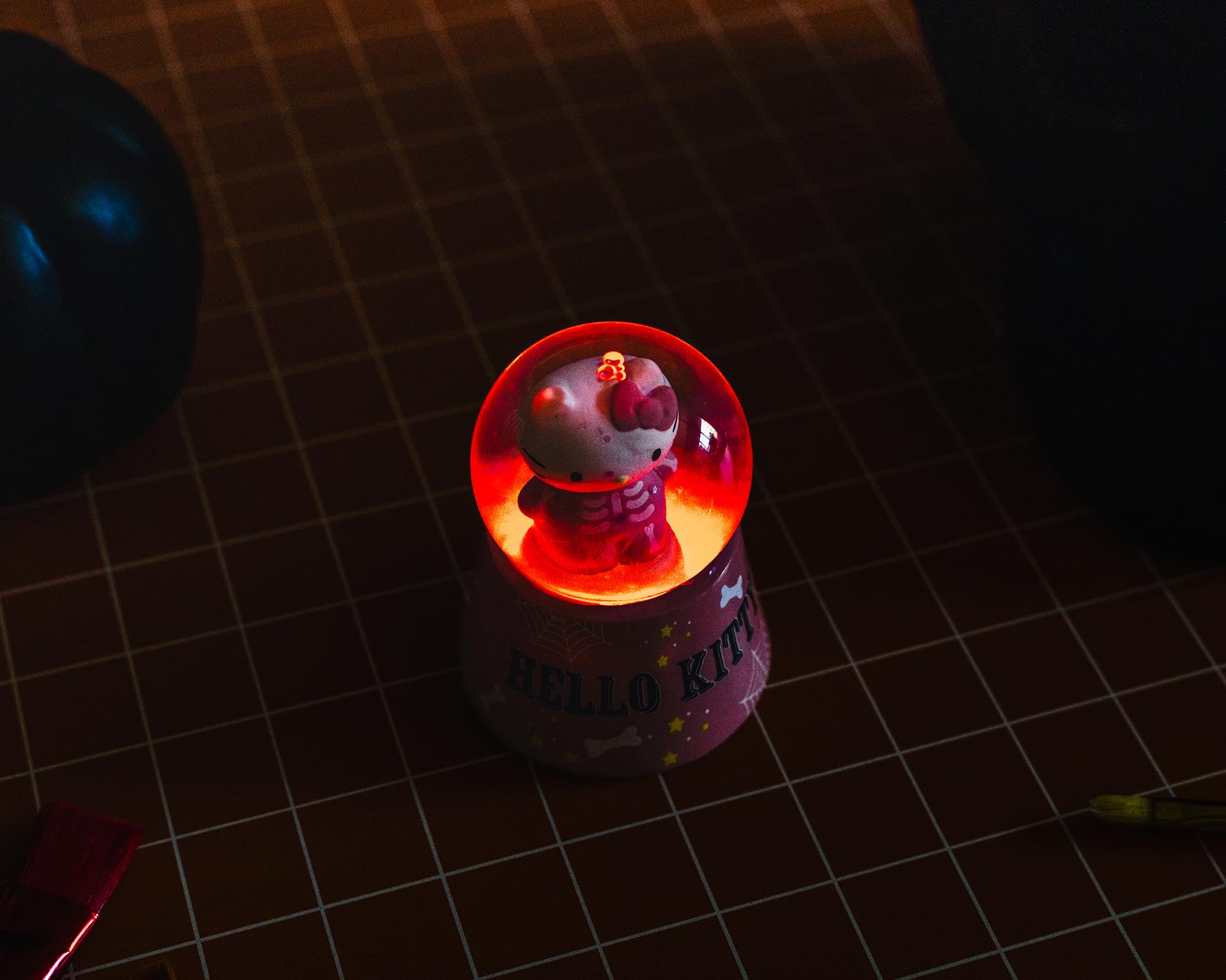 Sanrio Hello Kitty Pink Skeleton 3-Inch Mini Light-Up Snow Globe