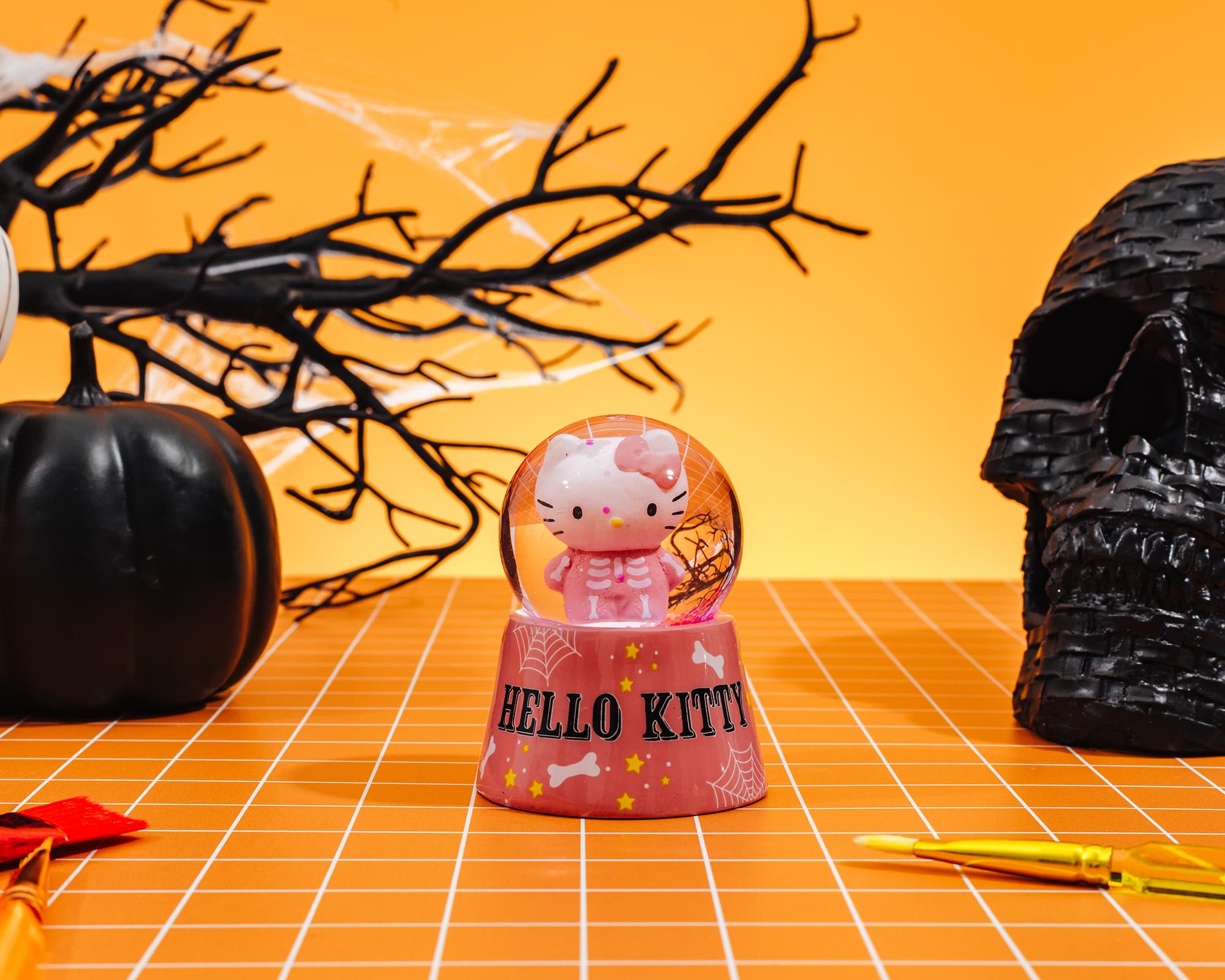 Sanrio Hello Kitty Pink Skeleton 3-Inch Mini Light-Up Snow Globe