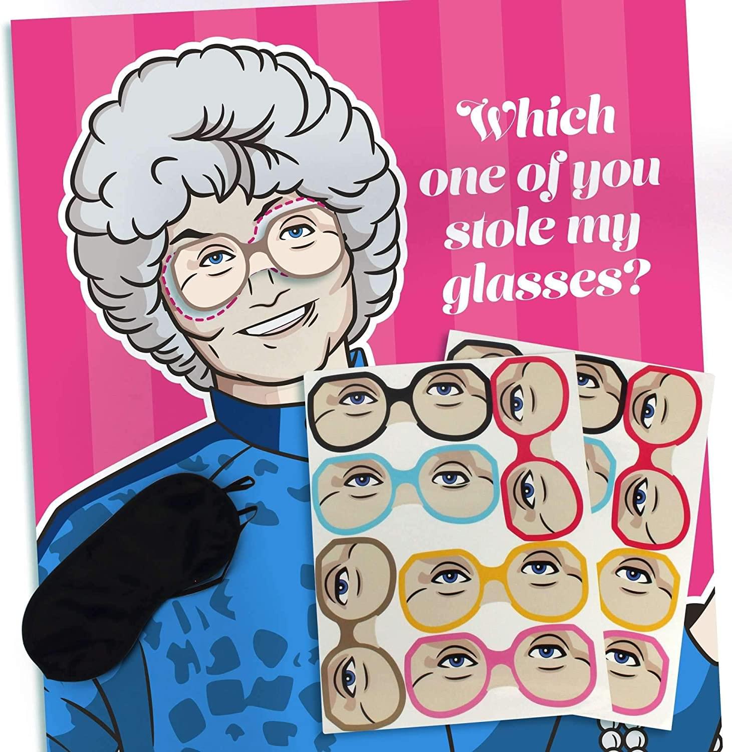 The Golden Girls Pin the Glasses on Sophia Party Game | Poster: 19.5" x 27.5", Includes 12 glasses (stickers) and one polyester blindfold.