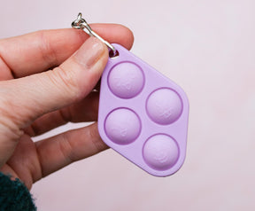 Pop Fidget Toy Purple 4-Button Silicone Keychain Accessory